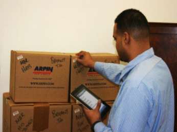 Arpin agent inspecting boxes