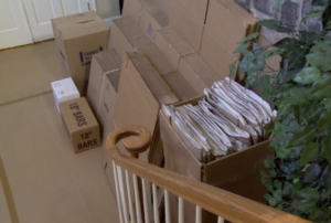 An abundance of neatly stacked Arpin of RI cartons, paper, and tape