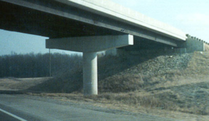 Ahighway bridge supported by a cylindrical concrete pier