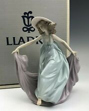 A very delicate and fragile LLardro porcelain figurine in front of its factory carton.